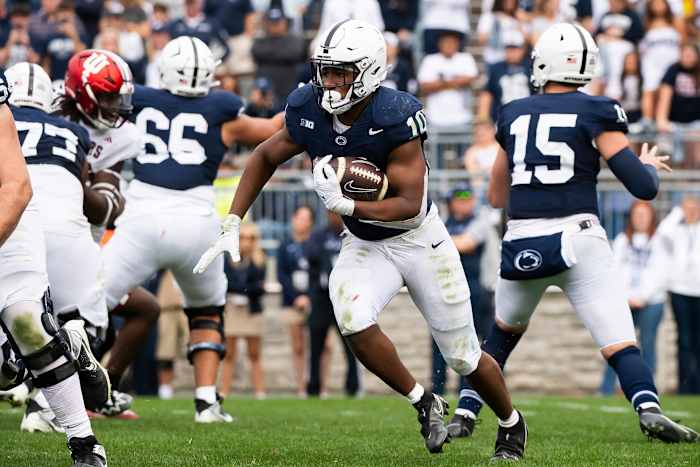 Penn State running back Nick Singleton (10) looks for a seam while carrying the ball in the second half of an NCAA football game against Indiana at Beaver Stadium Saturday, Oct. 28, 2023, in State College, Pa. The Nittany Lions won, 33-24.